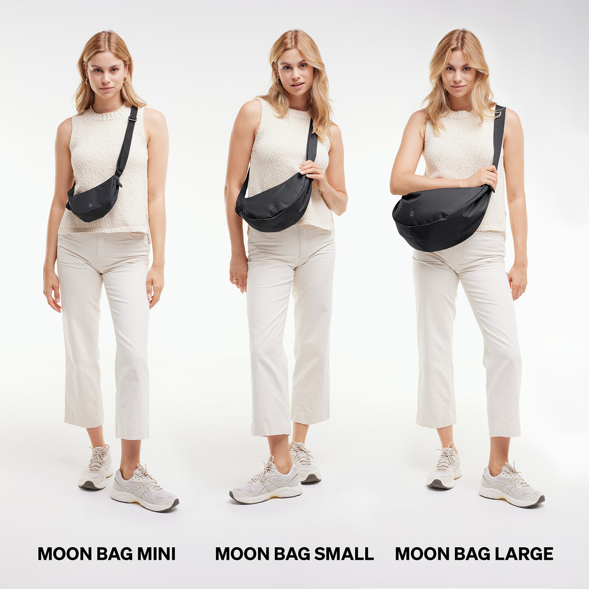 MOON BAG MINI Tasche in black (Schwarz) von einer Frau crossbody getragen.