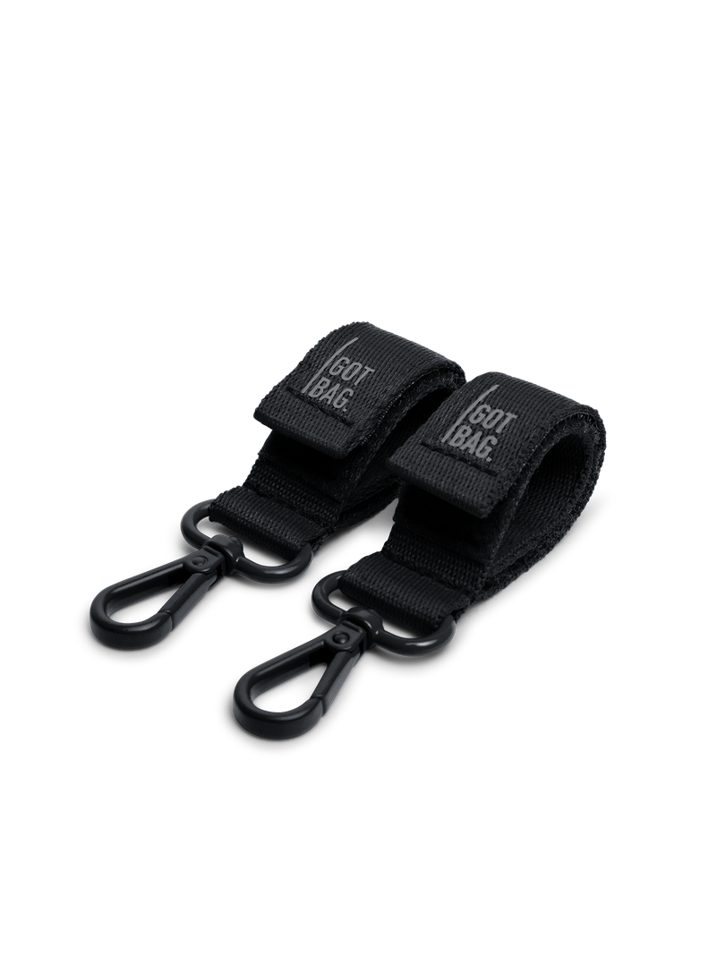 Dos accesorios STROLLER STRAP en black (Negro) como toma de estudio en vista frontal.