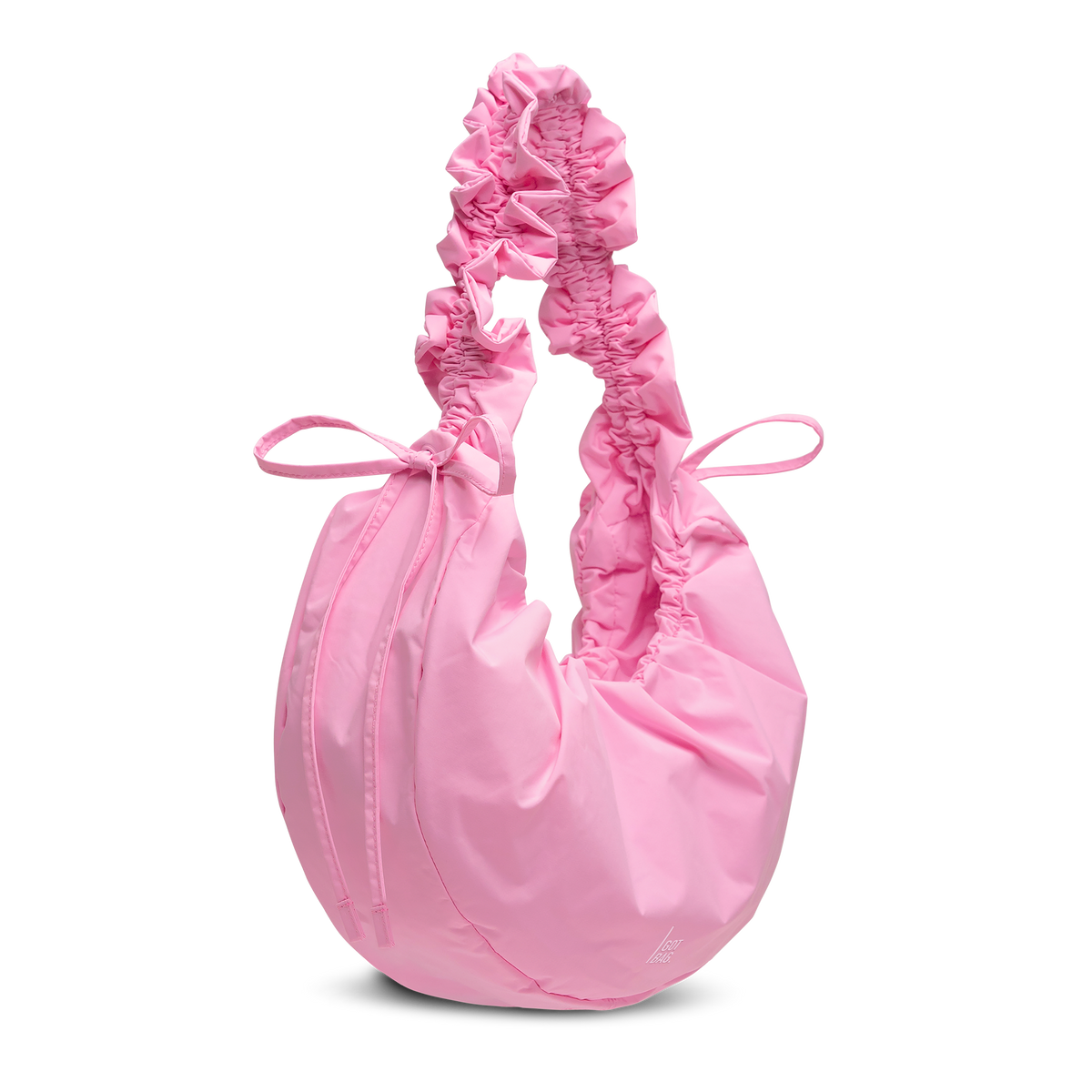 MOON BAG BOW Tasche in sea rose (sattes Pastell-Rosa) als Studioaufnahme in diagonaler Ansicht.