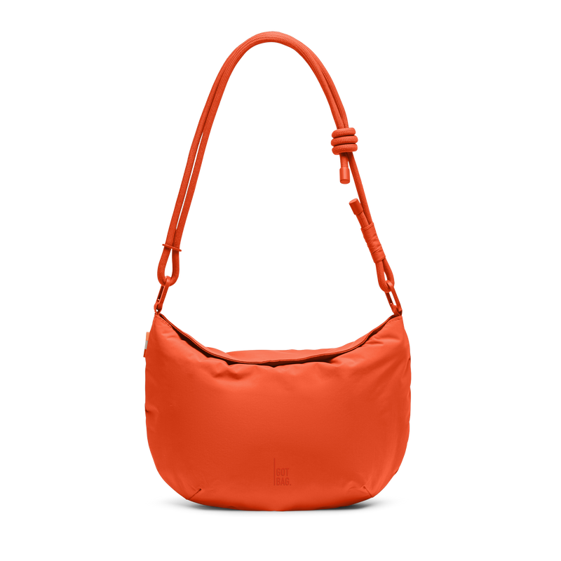 CLAM BAG bag in hot coral (vibrant orange) as a studio shot in front view.