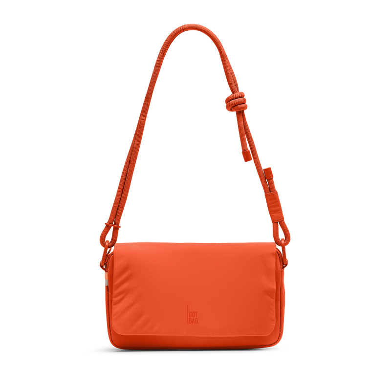 FACET BAG bag in hot coral (vibrant orange) as a studio shot in front view.