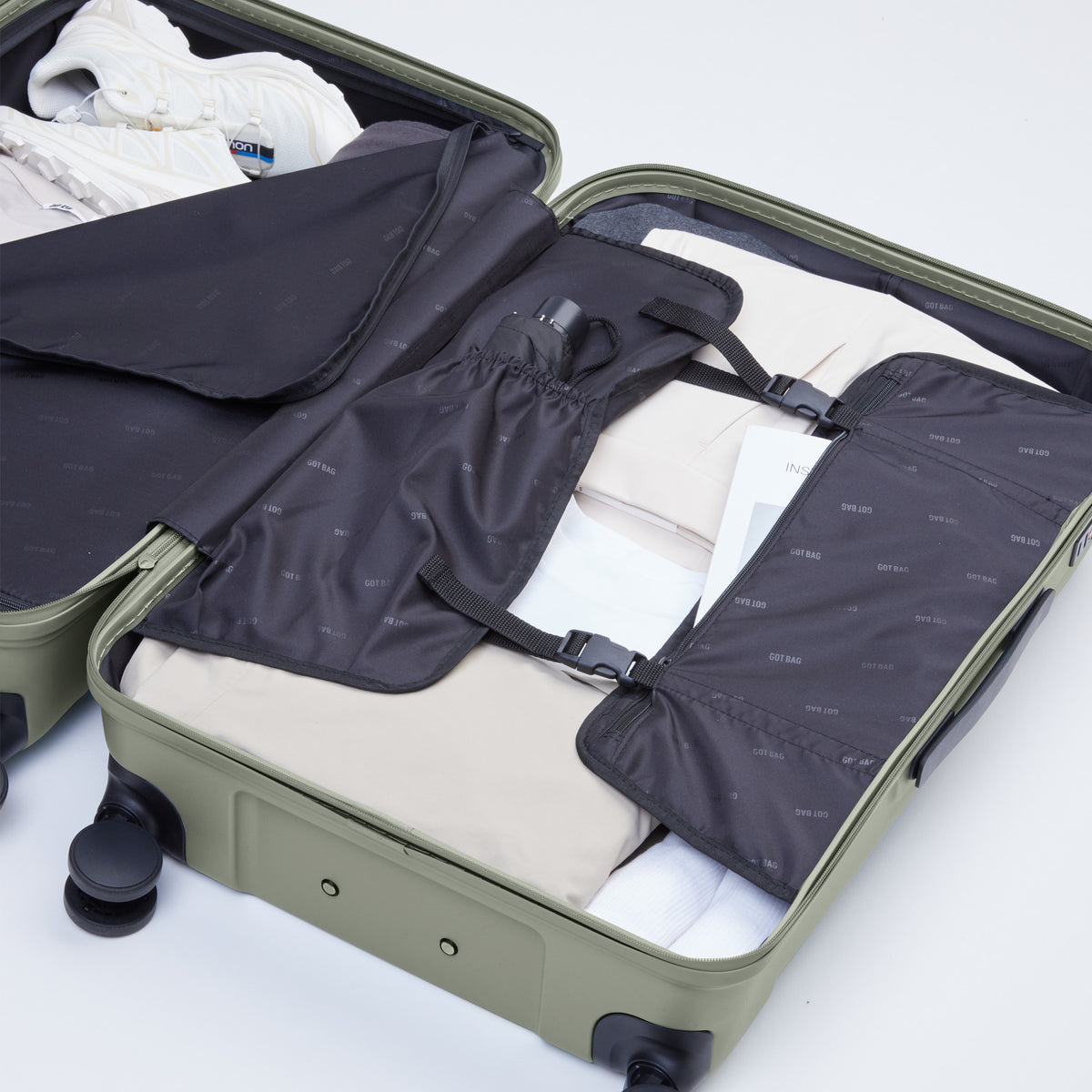 LU0022XX RE SHELL CHECKED Koffer in bass (Salbeigrün), innen geöffnet und gepackt.