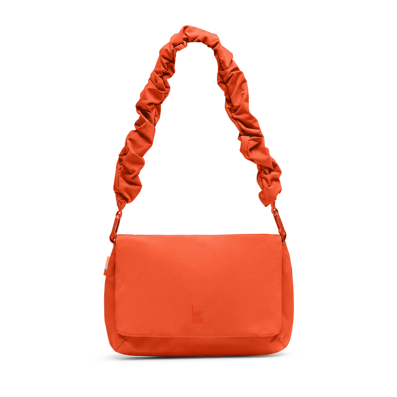LUCID BAG bag in hot coral (vibrant orange) as a studio shot in front view.