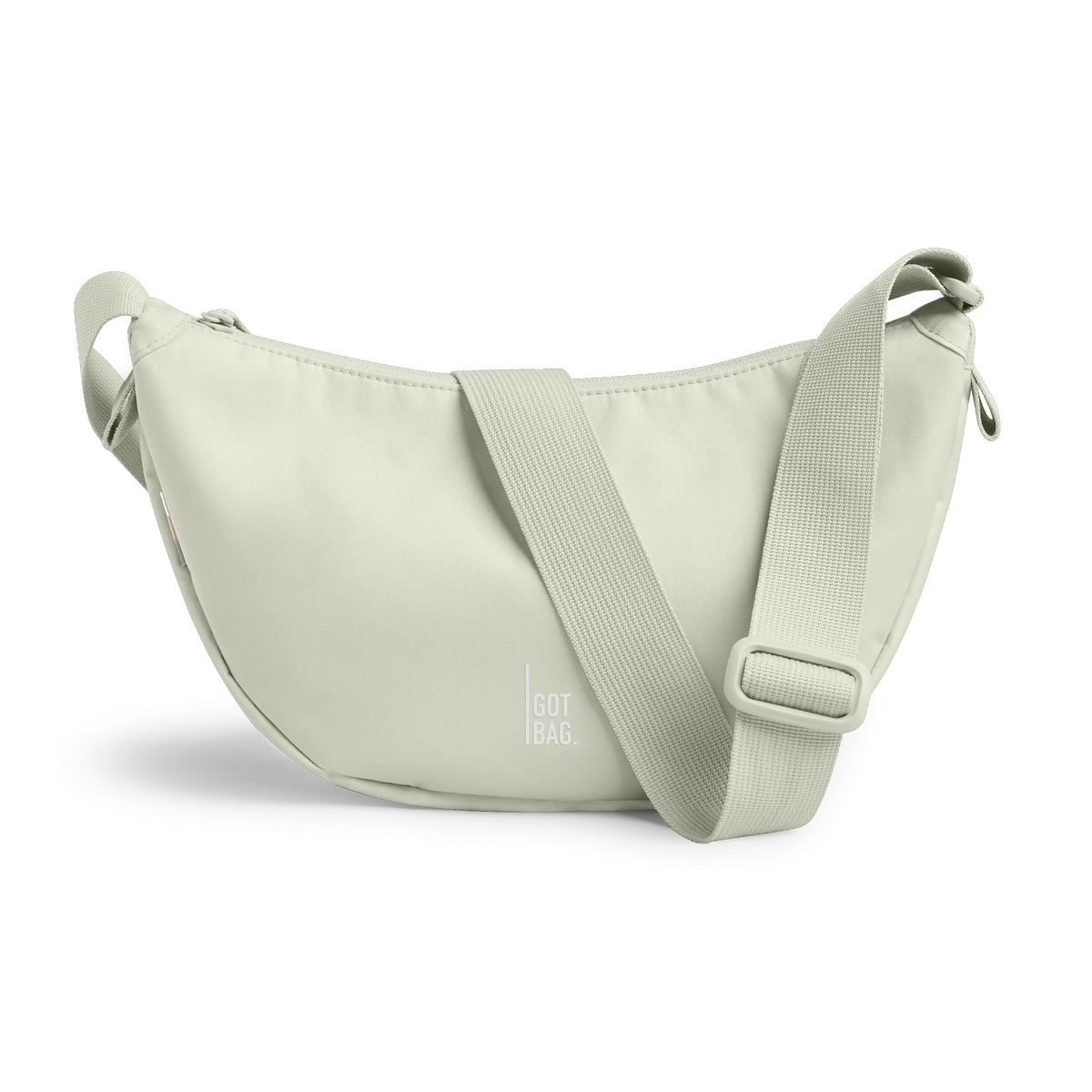 MOON BAG SMALL Monochrome Edition Tasche in beach foam (helles Grau) als Studioaufnahme in Frontansicht.