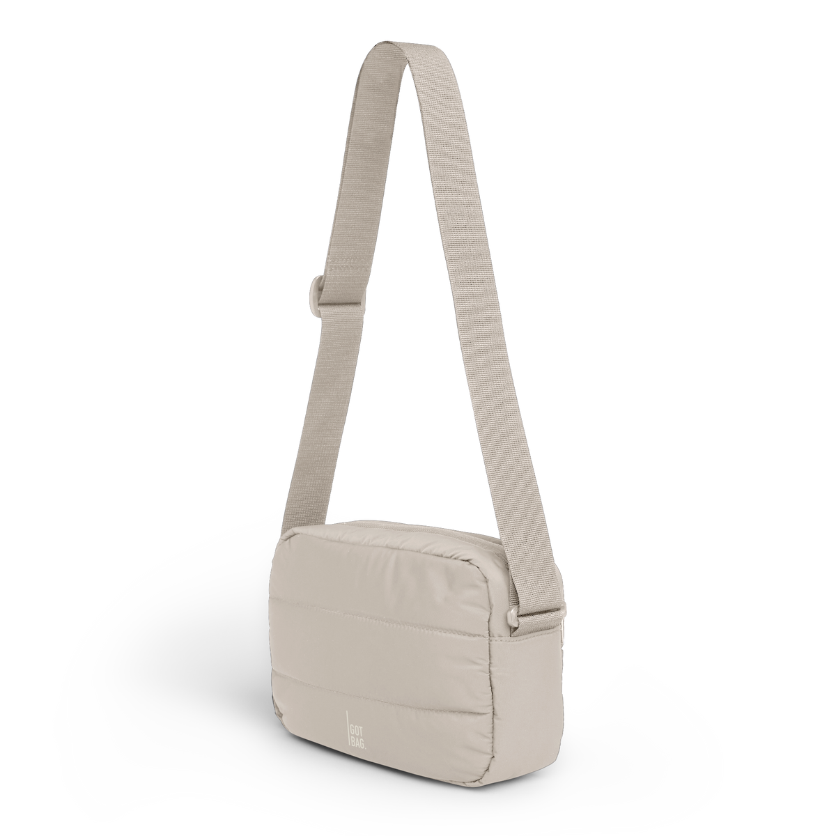 PUFFER CROSSBODY BAG Tasche in scallop (helles Beige) in diagonaler Ansicht.