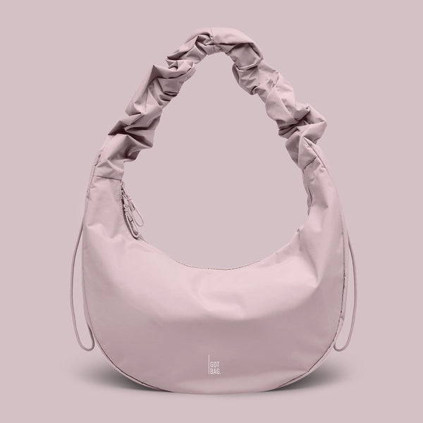 tas in pink dolphin (bleek lichtroze) als studio-opname.
